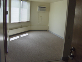 Riverview Heights empty living room with wall mounted air conditioner